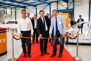 Pictured front left to right: Robert Wirth, Project Partner, Stephan Humpf, TE Plant Manager, and Roland Brandli, Mayor of Steinach during the ribbon cutting ceremony with TE Automotive leaders and other event attendees. (PRNewsFoto/TE Connectivity)