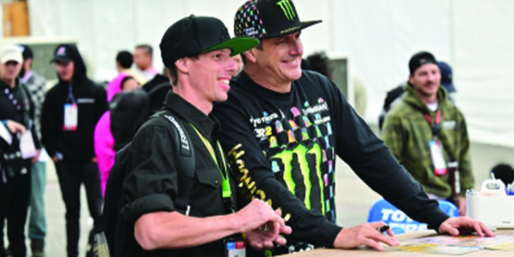 Photo Credit: SEMA; Ken Block takes a photo with a fan during an autograph session at the 2022 SEMA Show.